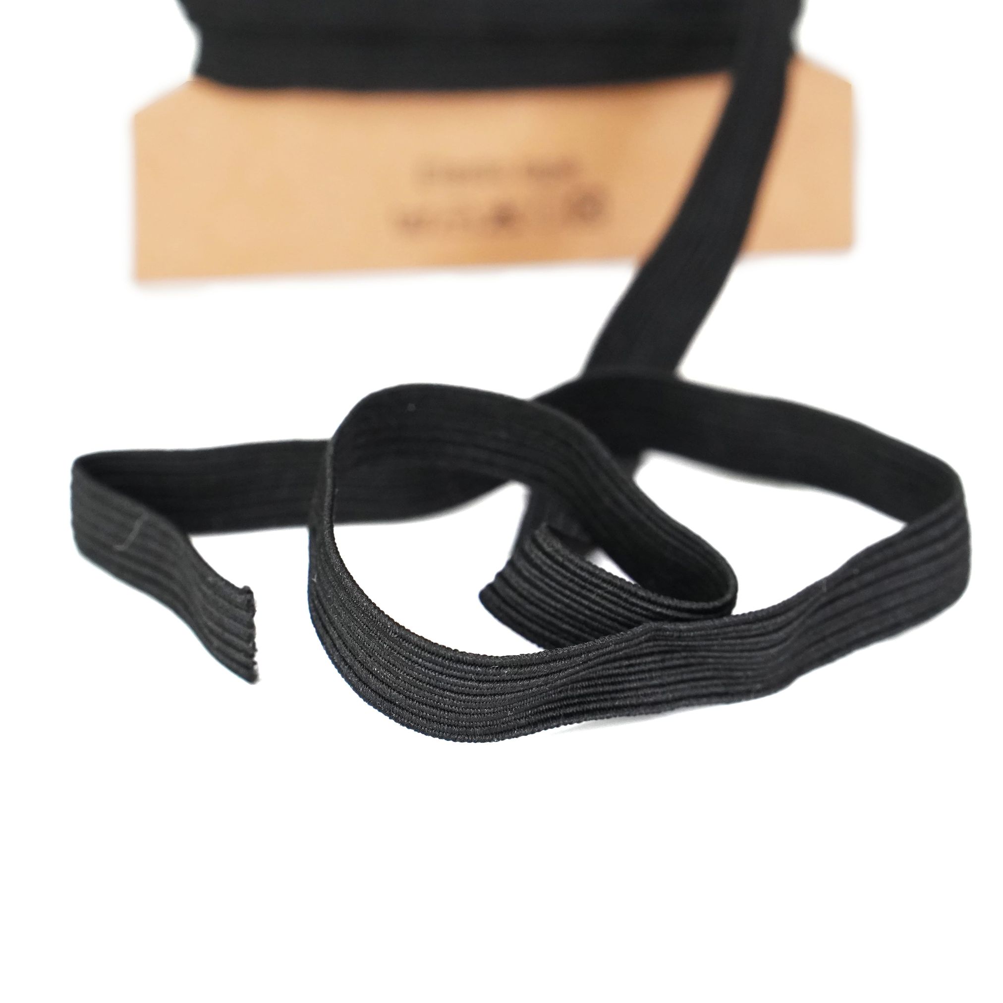 Trimz braided elastic on a card black close up